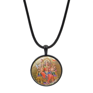 Detailed macro view of Durga goddess pendant with black cord necklace on white background