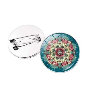 Detailed front and back view of Mandala glass cabochon brooch with silver metal safety pin