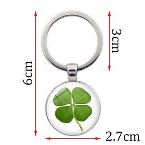 Porte-clés trèfle à quatre feuilles argenté avec pendentif en verre et taille de 6cm