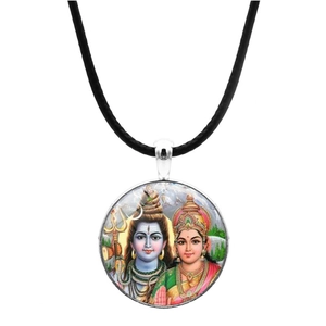 Macro detail of the silver-framed Hindu deity pendant on a black cord necklace