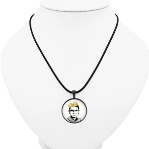 Detail of circular RBG portrait necklace with vintage leather cord on white display