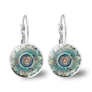 Detail view of Mandala art glass cabochon earrings with bohemian geometric pattern