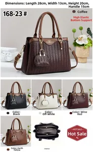 Detailed view of the woven shoulder bag's multi-compartment interior and dimensions