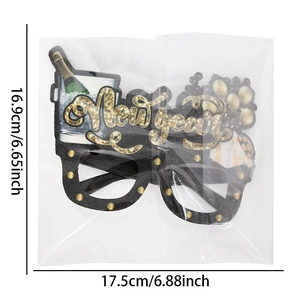 2026 New Year party glasses with gold glitter accents and festive celebration motifs