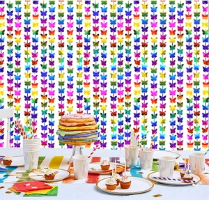 Close-up of vibrant rainbow butterfly tinsel curtain for birthday party backdrop decoration