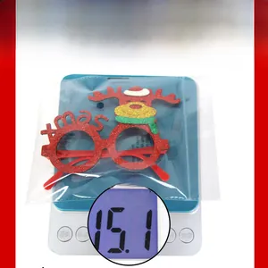 Christmas reindeer glasses frame weighing 15.1g on a digital scale for holiday party