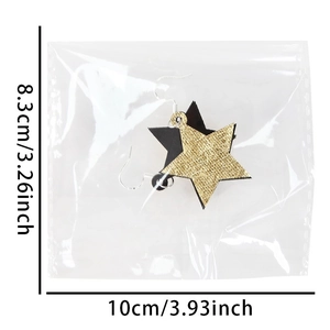 Orecchini a stella neri e dorati con design a fuochi d'artificio glitter per Capodanno