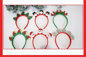Flat lay of six diverse Christmas headbands including Santa, reindeer, and tree designs