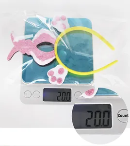 Easter rabbit ear headband set with pink mask and accessories shown on weight scale