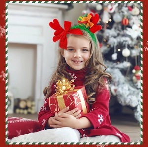 Detail view of child wearing festive reindeer antler headband with red bow and gift box decor
