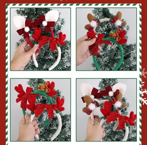 Close-up of four plush Christmas reindeer headbands with festive bows and pom-poms