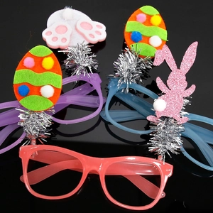 Easter glowing glasses set with rabbit ears and egg motifs on a glossy black background