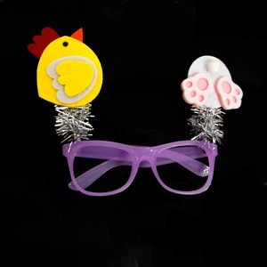 Detail of purple party glasses with yellow chick and white rabbit paw felt decorations