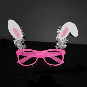 Close-up of pink plastic Easter glasses featuring white rabbit ears with pink glitter detail
