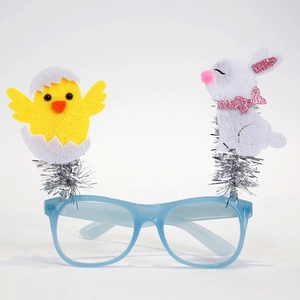 Detail of Easter party glasses frame with yellow chick and white bunny spring accents