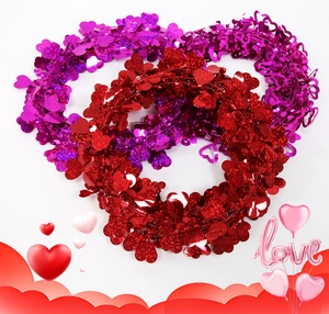 Detail of red and purple glitter heart garlands for Valentine's Day wedding party decor