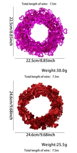 Detail of red and magenta heart tinsel garlands with specific size and weight specs