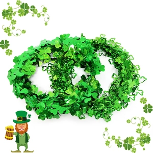 Green St. Patrick's Day shamrock tinsel garland for festive patio and home decoration