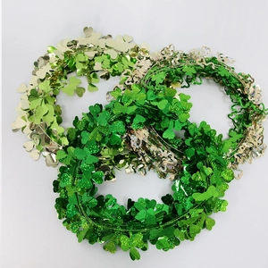 Three-pack St. Patrick's Day tinsel shamrock garlands in green and champagne colors