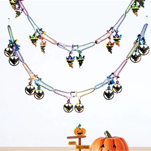Detail view of Halloween honeycomb hanging charms with iridescent ghosts and bats