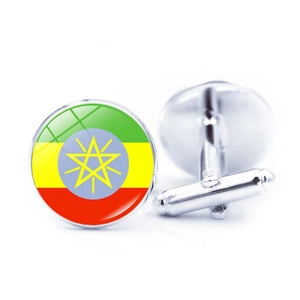 Detail of Ethiopia flag cufflinks showing the polished silver-tone metal and T-bar clasp