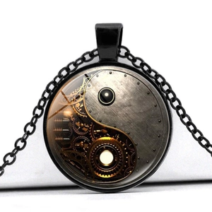 Detail of steampunk Yin Yang pendant with mechanical gears and black chain necklace