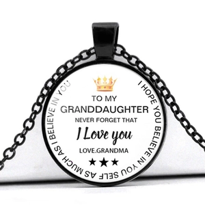 Close-up of black pendant necklace with inspirational message for granddaughter and crown icon