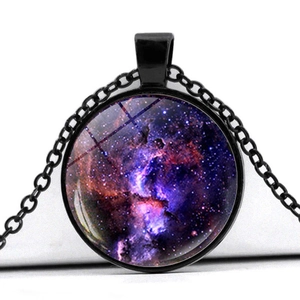 Detail view of round glass nebula pendant with vibrant purple galaxy art and black chain