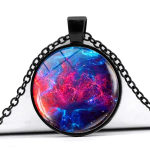 Detail of a round glass galaxy pendant with vibrant nebula patterns and black chain