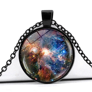 Detailed close-up of a glass dome galaxy pendant with vibrant cosmic nebula design
