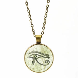 Detail showing Eye of Horus glass cabochon pendant with bronze vintage finish and chain
