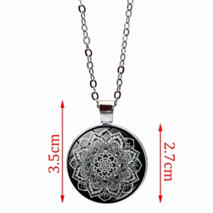 Mandala pattern glass pendant necklace in silver tone, 2.7cm diameter on white background