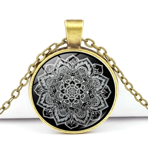 Vintage Mandala glass pendant necklace with antique bronze frame on a white background
