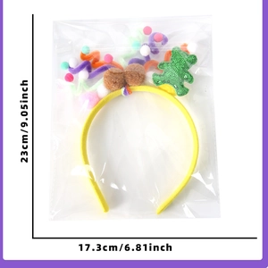 Detail van de kleurrijke pluche berenhoofdband met afmetingen 23cm bij 17cm in verpakking