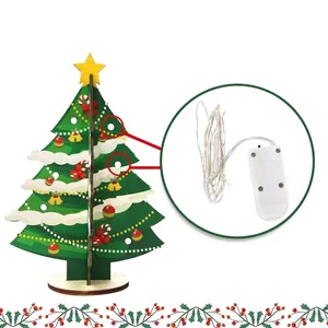 DIY wooden Christmas tree assembly kit with LED copper wire lights and festive patterns