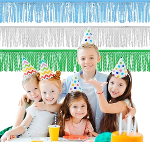 Kids celebrating with light blue, white, and green tinsel foil fringe curtains background
