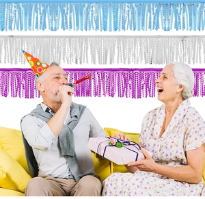 Detail of light blue, silver, and purple fringe curtains for festive party backdrop décor