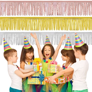 Colorful foil fringe curtains in pink, gold, and silver for birthday party background decor