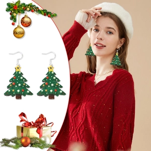 Detail of green Christmas tree earrings with colorful ornaments and silver hooks