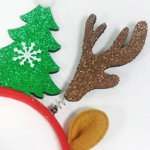 Christmas headband with sparkly green Christmas tree and brown reindeer antlers