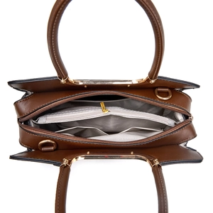 Top view of large tote bag interior showing three compartments and gold zipper details