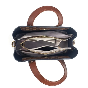 Top view showing the spacious interior compartments and brown monogram texture of the tote bag