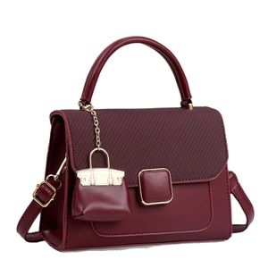 Burgundy contrast crossbody bag in smooth leather and herringbone fabric with mini charm