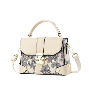 Women's paisley floral satchel bag with top handle and gold clasp in beige finish