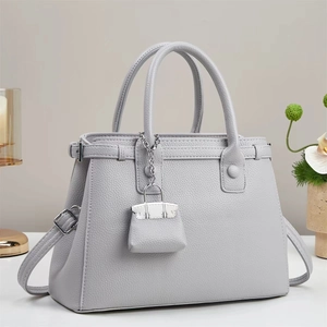 Elegant light gray lychee grain leather tote bag with silver hardware and pendant