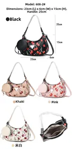 Vue détaillée des sacs hobo tissés avec motifs cerises et poche intérieure zippée