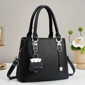 Elegant black lychee leather tote bag with silver chain and detachable shoulder strap
