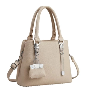 Minimalist beige litchi grain tote bag for women with silver hardware and mini charm