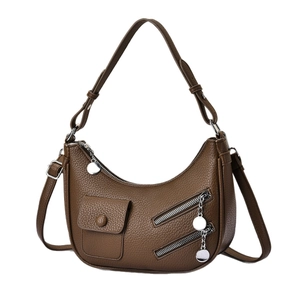 Deep brown crescent hobo bag with pebble leather texture and metal zipper details