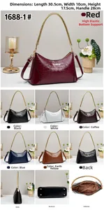 Detailed view showing dimensions and crocodile pattern textures of the faux leather bag